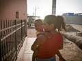 Pisco, Peru. Delia with her baby girl