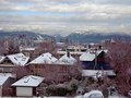 A city set on the water with a mountainous backdrop to wake up to