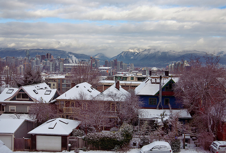 A city set on the water with a mountainous backdrop to wake up to