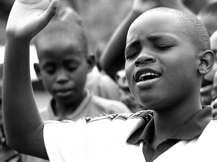 Uganda child worshipping