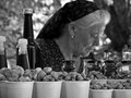 Selling mixed nuts and local olive. Plitvice National Park, Croatia. oil.