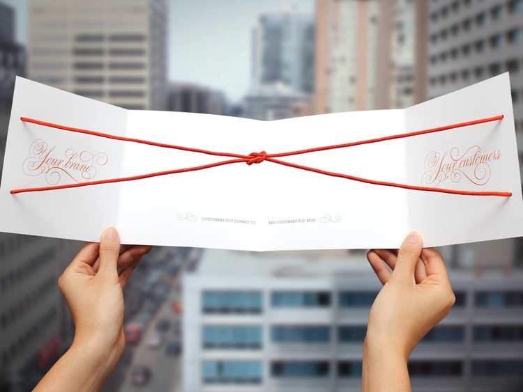 ...the string ties into a square knot, reenforcing the brand and message: Customers you commit to are customers you keep.