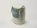 A sugar package unfolds into a tea towel.