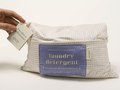 The laundry detergent package unfolds into a pillowcase.