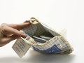 Looking inside the tea package.