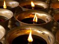 Oil lamps lit up at a temple on Mt Emei, Sichuan, China.