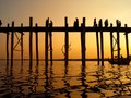 The U Bein Bridge in Amarapura, Myanmar, seen at sunset, is the longest teak bridge in the world.