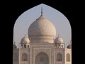 Crowds cluster at the entrance arch to the Taj Mahal, India, which welcomes hordes of visitors on the days it's open.