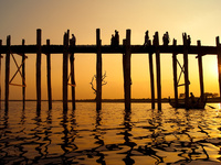 The U Bein Bridge in Amarapura, Myanmar, seen at sunset, is the longest teak bridge in the world.