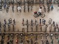 A man pushes his bicycle into a bicycle park at Boon Lay MRT Station, Singapore.