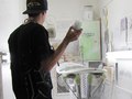 Kevin Walsh spraying the last coat at the Haut Shop