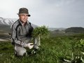 Restaurant chef gathering wild leaves - above Piano Perduto