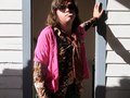 Local musician and Ames fashion icon Charlie Vestal poses for a portrait at the Beach Toys House during MAMF in Ames, Iowa.