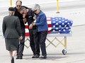 The family of Spc. Jake R. Veloza react after recieving his body at the San Francisco International Airport.