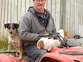 Mike Kehoe poses for a portrait with his dogs at the Kehoe family dairy farm inside the Point Reyes National Seashore, CA