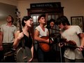 Bluegrass band Spirit Family Reunion performs in the living room of the Orange Gentleman in Ames Iowa.
