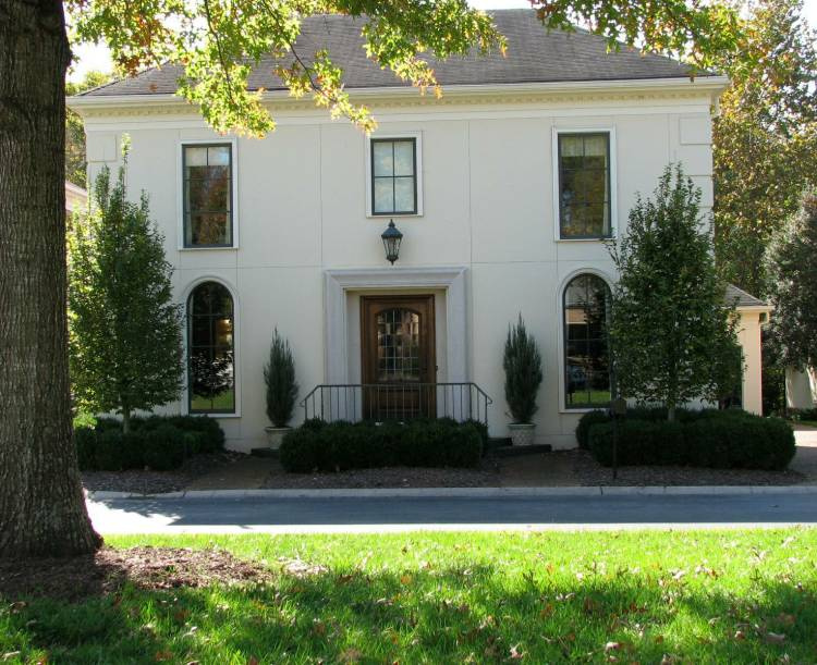 We replaced windows and simplified them, then painted them dark bronze.