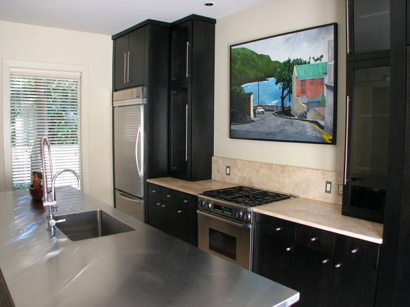 The legs on the island discretely conceal the plumbing and wiring.