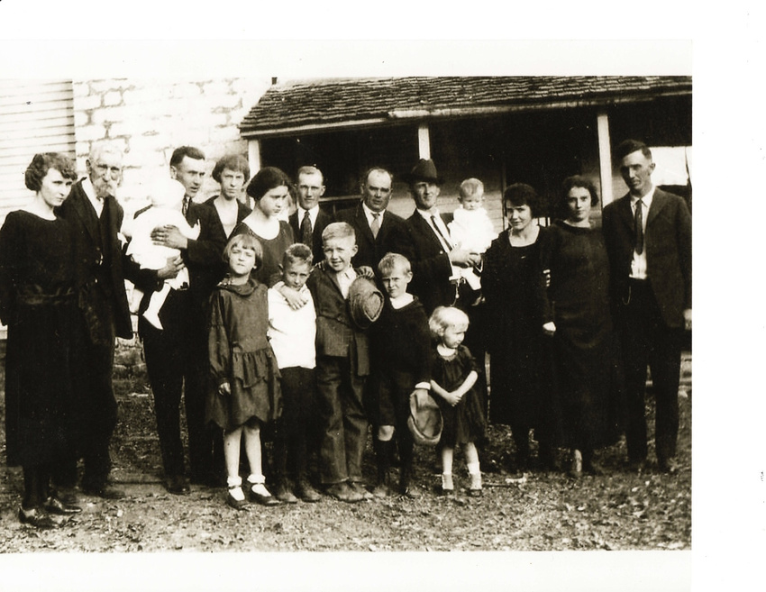 Same West Elevation with family gathered, circa 1925.