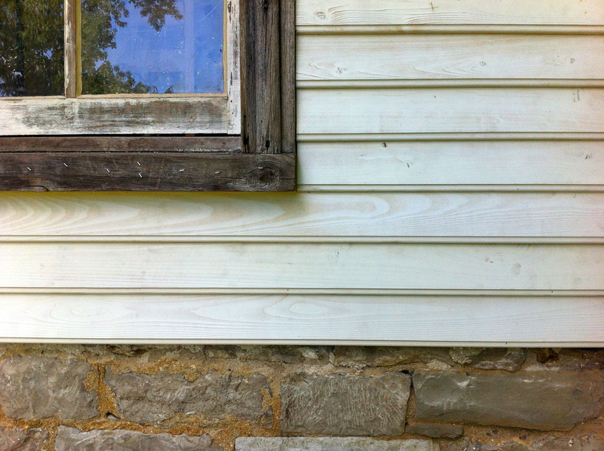 Detail of custom siding, casing and window.